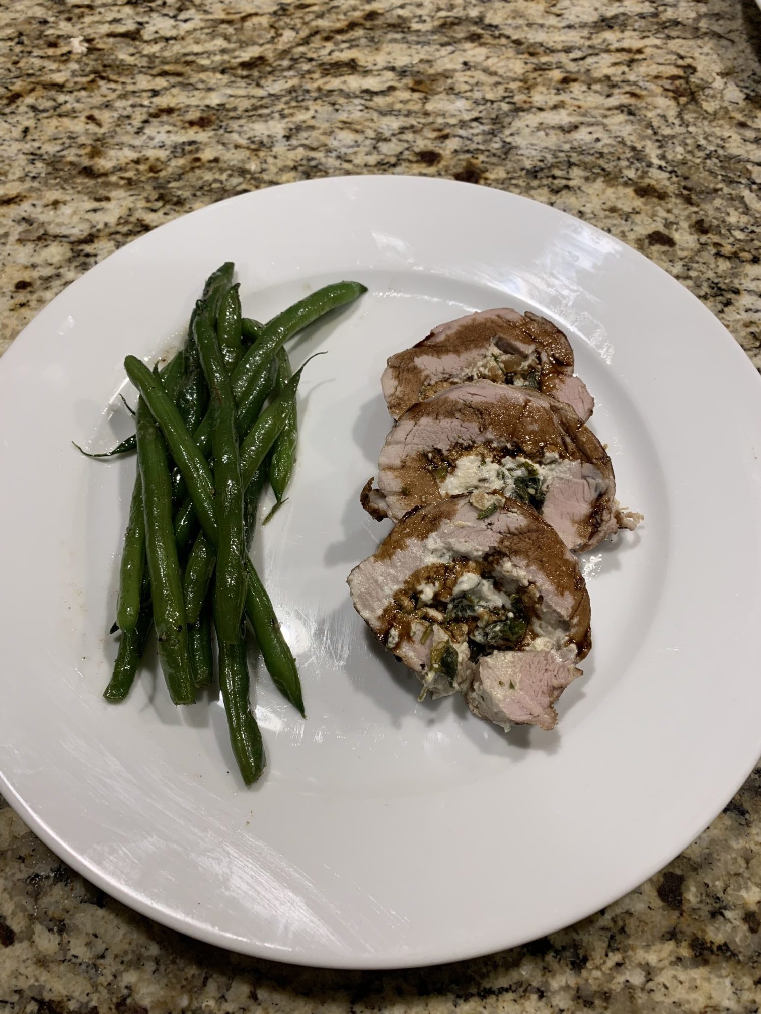 Pork Tenderloin Roulade with Bacon, Spinach, Goat Cheese, and Onion